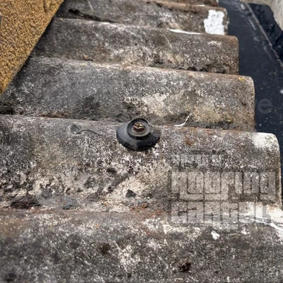 Bolt heads on asbestos roof