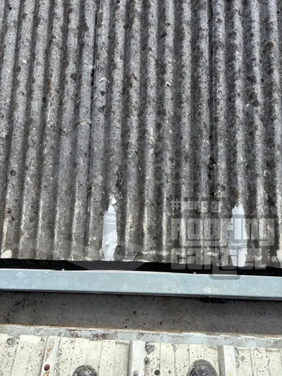 Professional asbestos roof crack repair showing LAVA 20 waterproofing system application